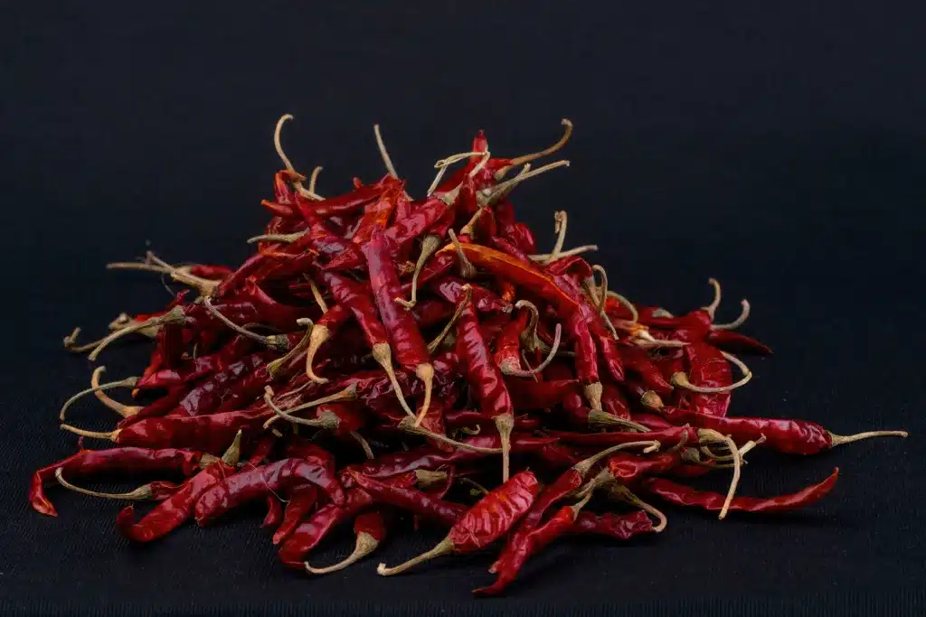 Lots of red chilies with black background